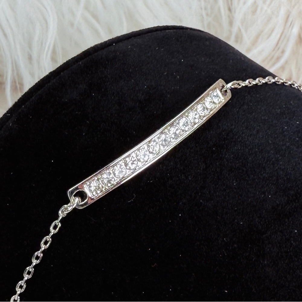 Elegant Silvertone adjustable Bracelet with Crystal Accents